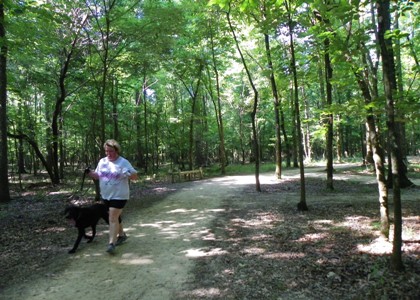 Lady with dog on trail resized